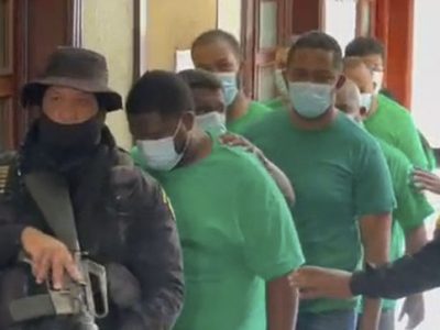 Dictan un año de prisión preventiva a red que estafó al Banco BHD