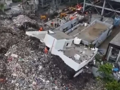 Tres muertos y más de diez atrapados en derrumbe de vertedero en India